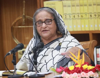 সংবাদ সম্মেলনে বক্তব্য দিচ্ছেন প্রধানমন্ত্রী শেখ হাসিনা। ইমেজ: ইয়াসিন কবির জয় 